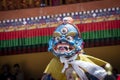 Tibetan man, dressed in a mystical mask, perform a dance during the Buddhist festival in Hemis monastery, Ladakh, India