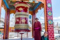 A Tibetan man playing the prayer wheel of Gompa Soma at the  Street of Leh City, Ladakh, Jammu and Kashmir Royalty Free Stock Photo