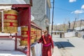 A Tibetan man playing the prayer wheel of Gompa Soma at the  Street of Leh City, Ladakh, Jammu and Kashmir Royalty Free Stock Photo