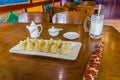 Tibetan meal - momos dumplings and yak mil Royalty Free Stock Photo