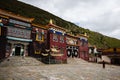 Traditional Tibetan monastery with cloudy sky above