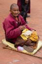 Tibetan monk reading a old tibetan manuscript Royalty Free Stock Photo