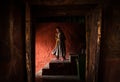Tibetan monk woman goes down the stairs in Thiksey Monastery