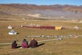 A Tibetan monks sitting on the hill at sunlight in Yarchen Gar