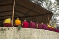 Tibetan monks are sitting under the roof