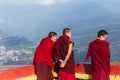 Tibetan monks watched the view in upper level of Rumtek Monastery near Gangtok. Sikkim, India.