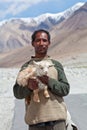Tibetan nomad with goatling, India