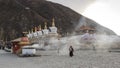 Tibetan people walking around Mani Temple Mani Shicheng a famous landmark in the Tibetan city of Yushu Jyekundo, Qinghai, Chin Royalty Free Stock Photo