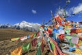 Tibetan Prayer Flags on foreground and Jade Dragon Snow Mountain on background Royalty Free Stock Photo