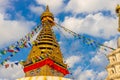 Prayer flags on big stupa with buddha eyes in Nepal Royalty Free Stock Photo