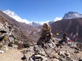 Tibetan prayer flags & stone cairns overlooking Dingboche & the Imja Khola river valley, with Mt Lhotse on the left, Nepal
