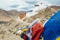 Tibetan prayer flags with Tsemo Monastery in Leh on background Royalty Free Stock Photo