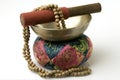Tibetan Singing Bowl with sandalwood prayer beads Royalty Free Stock Photo