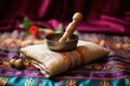 tibetan singing bowl with striking mallet on table Royalty Free Stock Photo