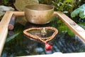 Tibetan singing bowls close up for a sound healing therapy session with a Ganesha deity and Mala