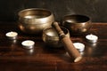 Tibetan singing bowls set with candles Royalty Free Stock Photo