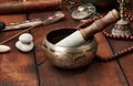 Tibetan singing copper bowl with a wooden clapper, objects for meditation and alternative medicine. Plunging into a trance Royalty Free Stock Photo