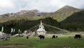 Tibetan white pagoda prayer flags at Siguniang Mountain in Chengdu, Sichuan, China. Royalty Free Stock Photo