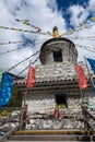 Tibetan white pagoda prayer flags at Siguniang Mountain in Chengdu, Sichuan, China. Royalty Free Stock Photo