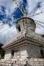 Tibetan white pagoda prayer flags at Siguniang Mountain in Chengdu, Sichuan, China. Royalty Free Stock Photo