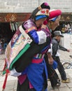 Tibetan Woman Carrying Child