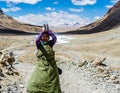 Tibetan woman commits bark around Mount Kailash. Royalty Free Stock Photo