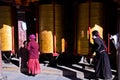 Tibetan women and Buddhist Prayer Wheels