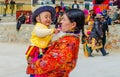 Tibetan women in traditional dress on holiday in the area