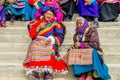 Tibetan women in traditional dress on holiday in the area