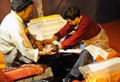 Tibetan workers printing an sutras Royalty Free Stock Photo