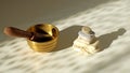 Tibetian singing bowl and stone pyramid on the table, abstract shadows and sunlight. Relaxation concept