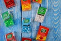 TIC TAC candies variety of mint boxes of packages on old wood background