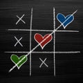 Tic tac toe game with chalk hearts, XO noughts and crosses Valentine`s Day style Royalty Free Stock Photo