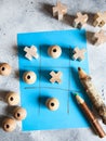 Tic tac toe game with wooden figures Royalty Free Stock Photo