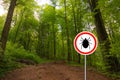 Tick sign in a green forest