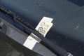 Parking tickets behind the windscreen wiper