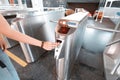 ticket token in the passenger`s hand before passing through the turnstile in the subway