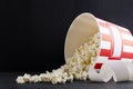 Tickets, big bucket of tasty popcorn.Concept of movie theater.Empty black spce for text Royalty Free Stock Photo