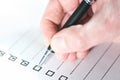 ticking off checklist with ballpoint pen Royalty Free Stock Photo