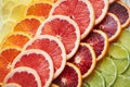 Tickle your tastebuds with some tasty citrus. a variety of citrus fruits cut into slices.