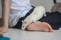 Tickling concept. Tickle your foot. child and white rat at the heel