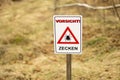 Ticks warning sign `Vorsicht Zecken` in Germany. Translation: Attention! Beware of Ticks! Royalty Free Stock Photo