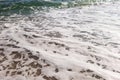 Tidal bore. A wave runs onto a sandy beach. Autumn sea. Sea wave. Pebbles Royalty Free Stock Photo