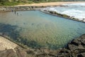 Tidal Pool Against Beach and Coastal Residential Buildings Lands