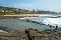 Tidal Pool Against Beach and Coastal Residential Buildings Lands