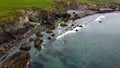 Tidal waves of the Atlantic Ocean near the southern coast of the island of Ireland. Rocky seashore. Seascape, top view. Aerial