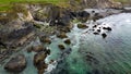 Tidal waves of the Atlantic Ocean near the southern coast of the island of Ireland. Rocky seashore. Seascape, top view. Aerial