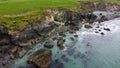 Tidal waves of the Atlantic Ocean near the southern coast of the island of Ireland. Rocky seashore. Seascape, top view