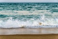 Tidal waves on a sandy beach Royalty Free Stock Photo