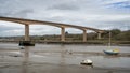 Tide out in Bideford, north Devon, England, UK. View of boats and new bridge. River Torridge estuary.